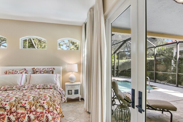 living room featuring ceiling fan with notable chandelier, light tile patterned floors, and built in features