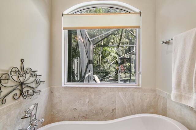 bathroom with a shower with door