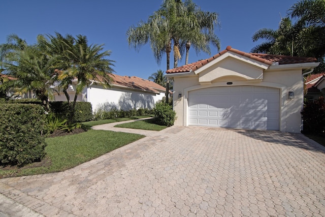 view of front of home with a garage