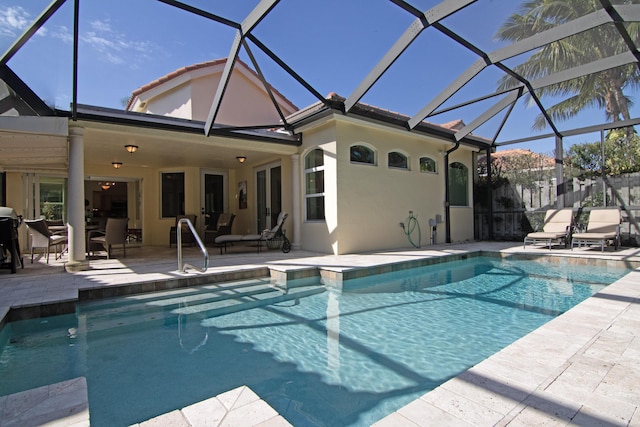 view of pool featuring a lanai and a patio area