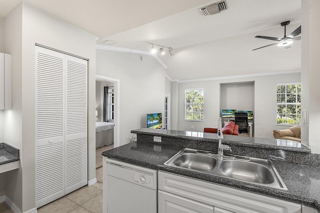 kitchen with white dishwasher, ceiling fan, sink, white cabinets, and lofted ceiling