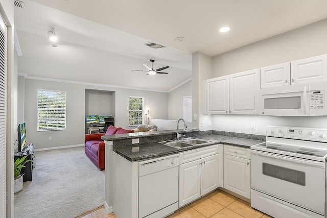 kitchen with white cabinetry, light colored carpet, white appliances, and sink