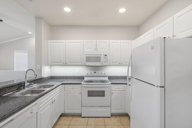 kitchen featuring light tile patterned flooring, white appliances, white cabinetry, and sink