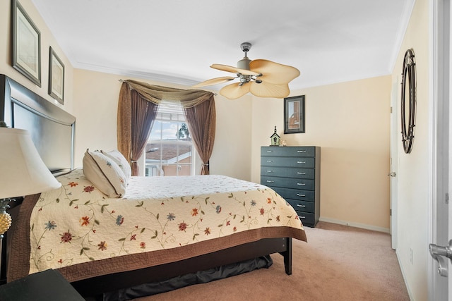 bedroom with light carpet, ceiling fan, and crown molding