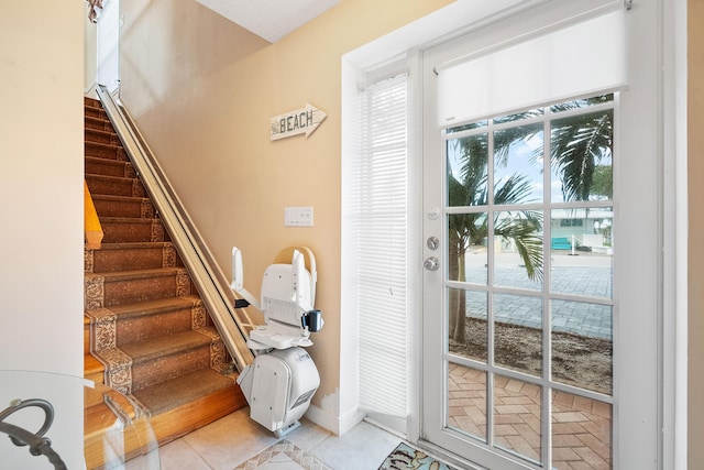 doorway with tile patterned flooring