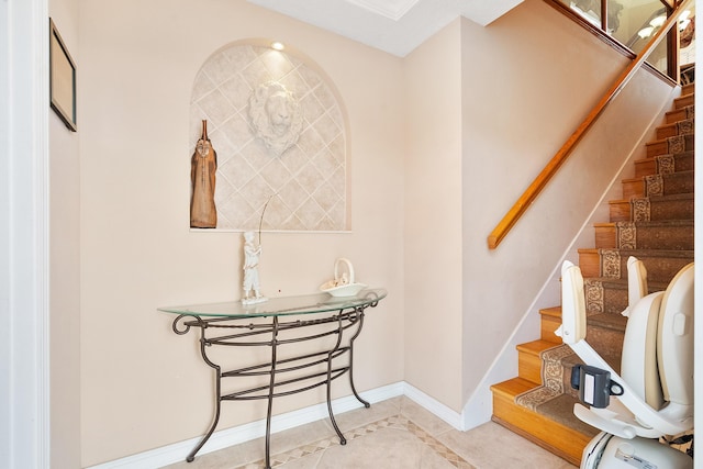 stairs featuring tile patterned floors