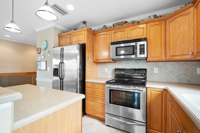 kitchen featuring stainless steel appliances, crown molding, pendant lighting, decorative backsplash, and light tile patterned flooring