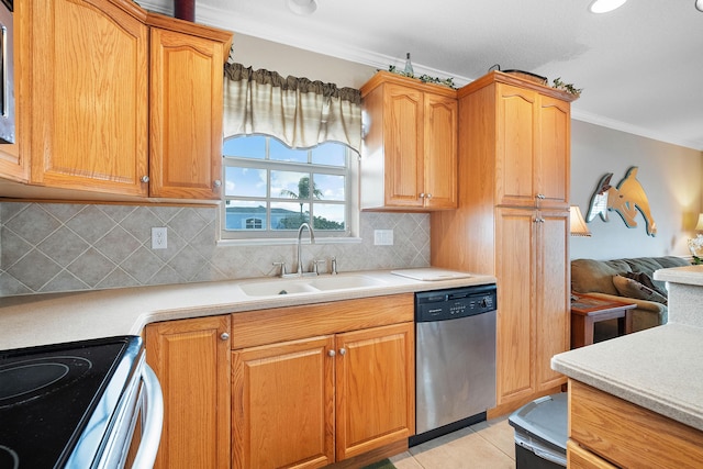 kitchen with sink, stainless steel dishwasher, decorative backsplash, ornamental molding, and light tile patterned flooring