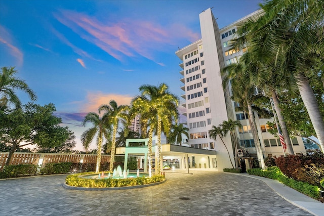 view of outdoor building at dusk