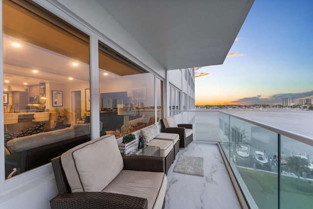 balcony at dusk with outdoor lounge area