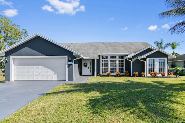 ranch-style house with a front yard and a garage