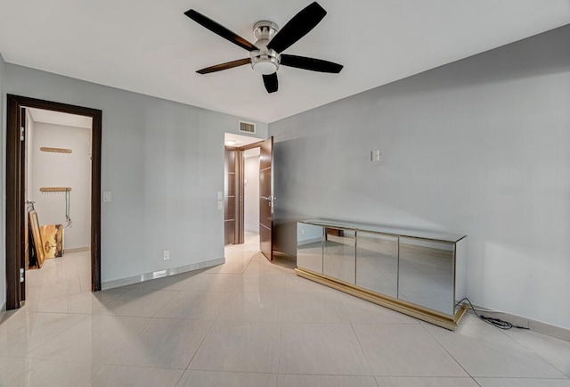 interior space with ceiling fan