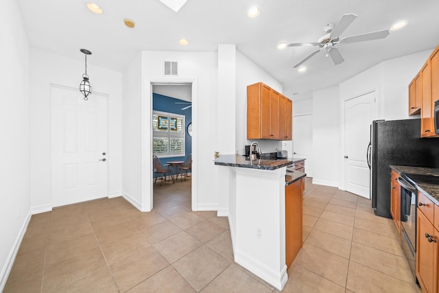 kitchen featuring stainless steel appliances, light tile patterned flooring, ceiling fan, and pendant lighting