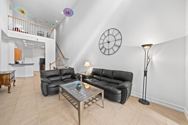 tiled living room with a high ceiling