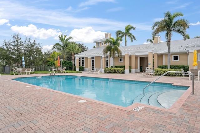 view of swimming pool with a patio