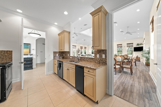 kitchen with sink, black appliances, stone countertops, ornamental molding, and light brown cabinets