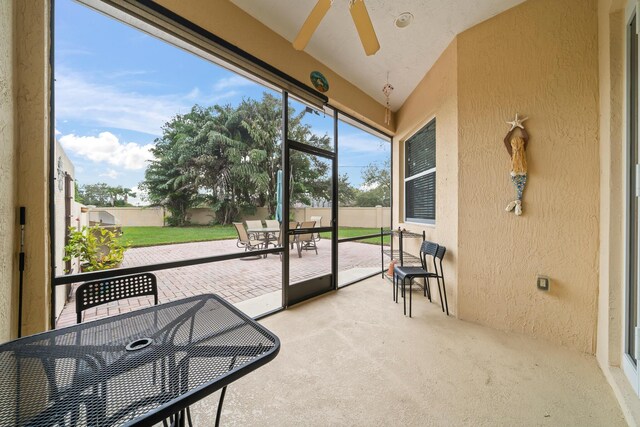 exterior space with a balcony and a garage