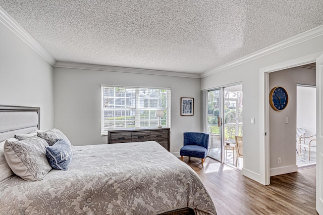 bedroom featuring wood finished floors, access to outside, a textured ceiling, ornamental molding, and baseboards