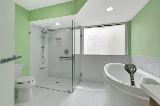 full bathroom with tile patterned floors, vanity, independent shower and bath, and toilet