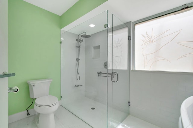 bathroom with tile patterned floors, an enclosed shower, and toilet