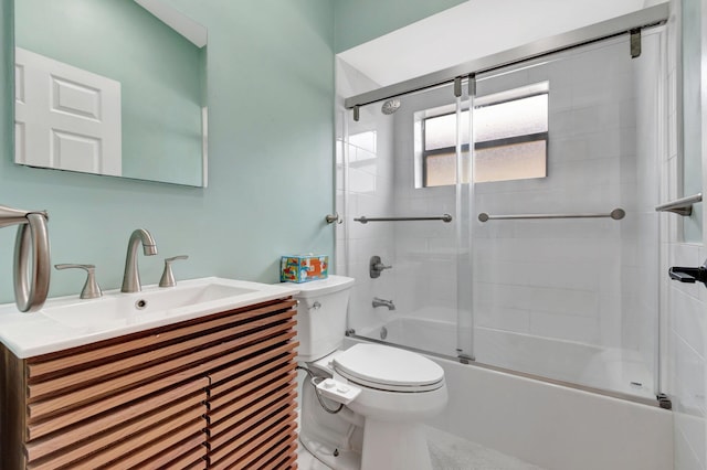 full bathroom with vanity, enclosed tub / shower combo, and toilet