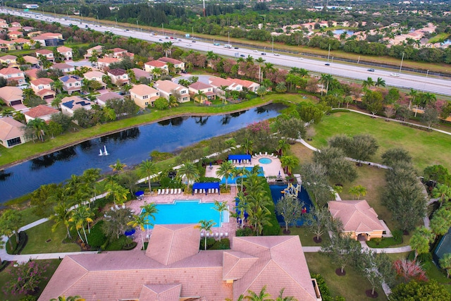 birds eye view of property with a water view