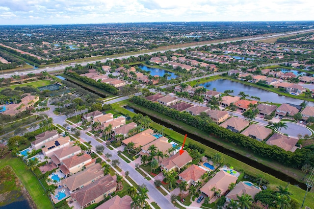 drone / aerial view with a water view