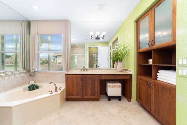 bathroom featuring vanity, shower with separate bathtub, tile patterned flooring, and a notable chandelier