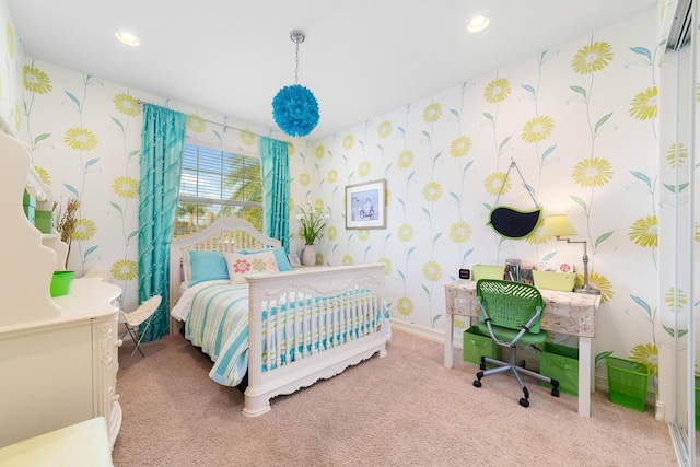 bedroom featuring a crib and carpet floors