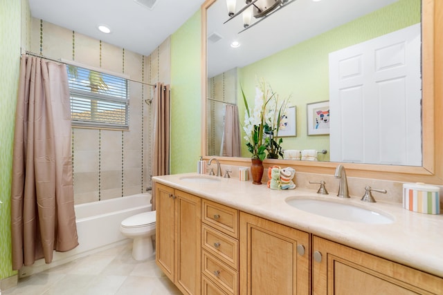 full bathroom featuring vanity, toilet, and shower / bath combo