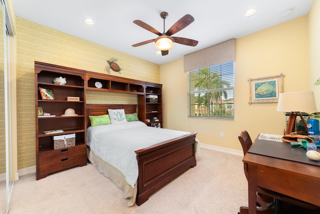 carpeted bedroom with ceiling fan