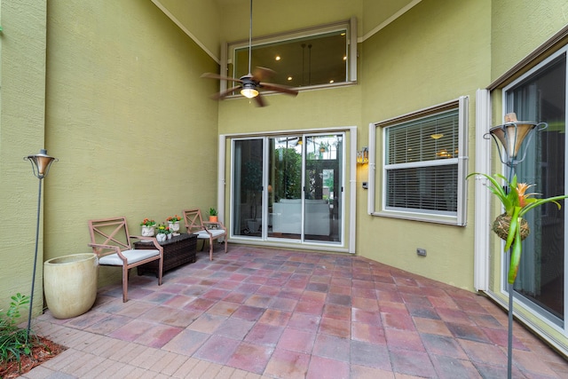 view of patio featuring ceiling fan