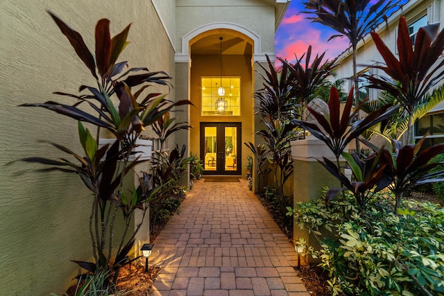 exterior entry at dusk with french doors