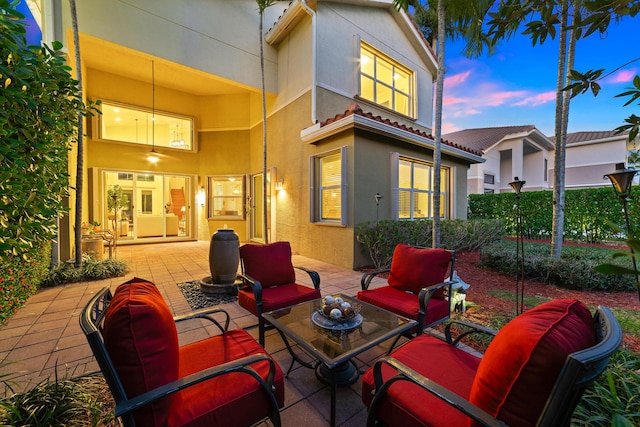 patio terrace at dusk with an outdoor living space