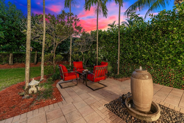 view of patio terrace at dusk