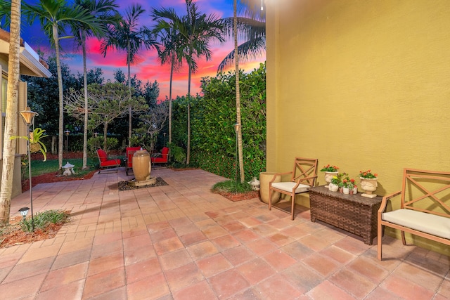 view of patio terrace at dusk