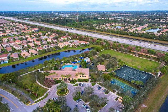 birds eye view of property with a water view