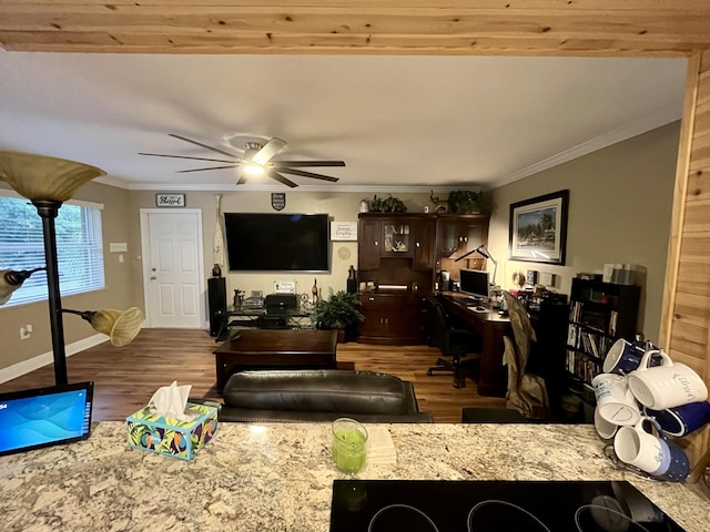 living room with hardwood / wood-style floors, ceiling fan, and ornamental molding