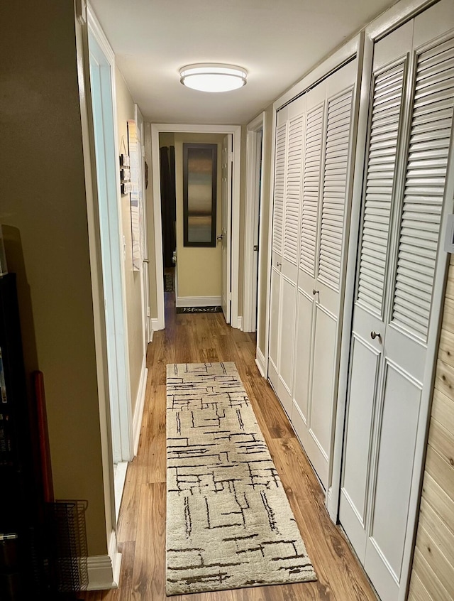 corridor featuring light wood-type flooring