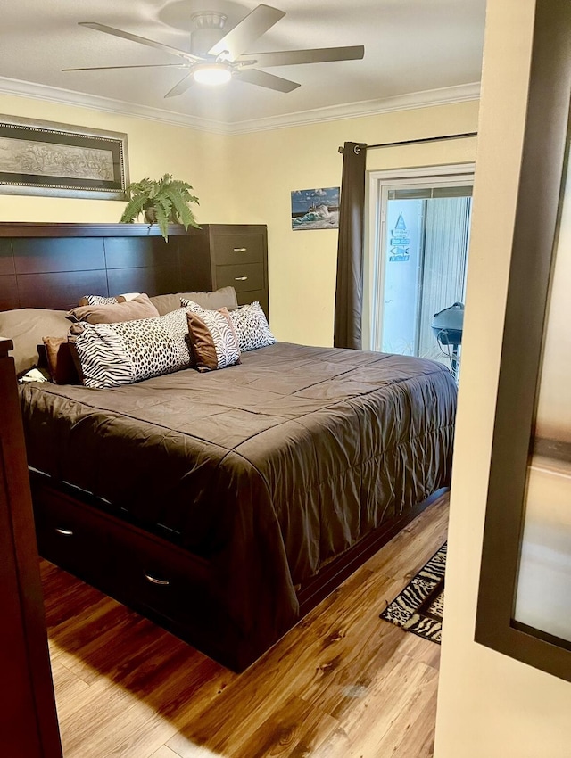 bedroom with ceiling fan, light wood-type flooring, and ornamental molding