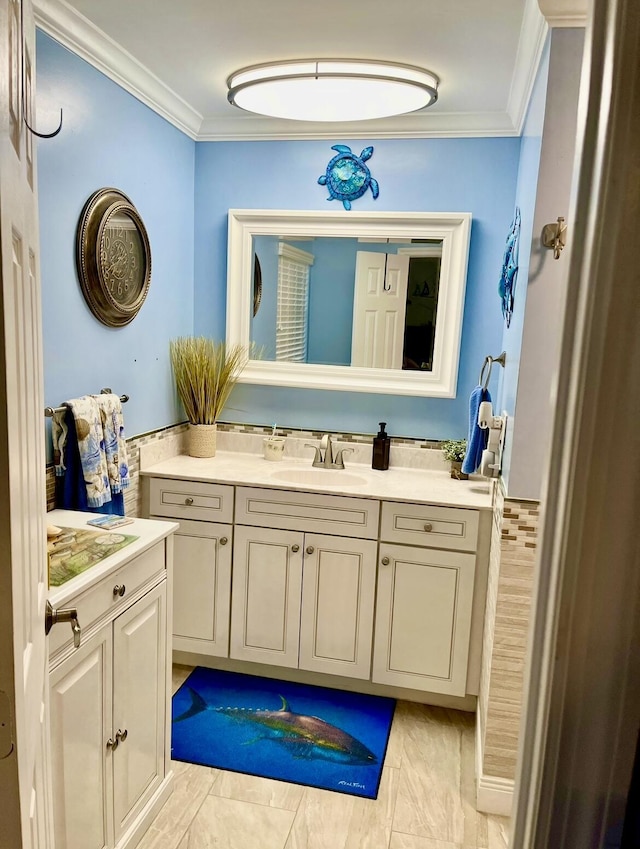 bathroom with vanity and crown molding