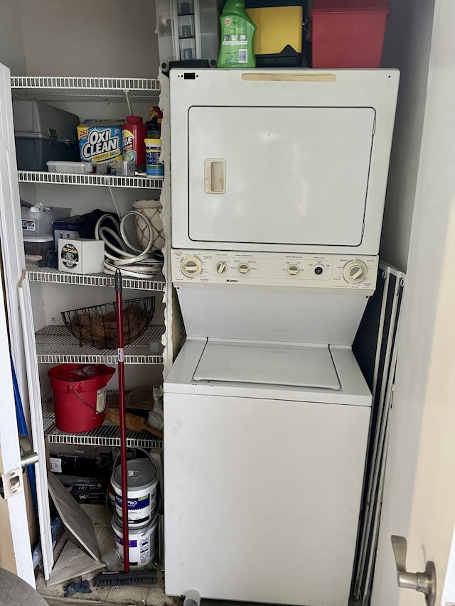 laundry area featuring stacked washing maching and dryer