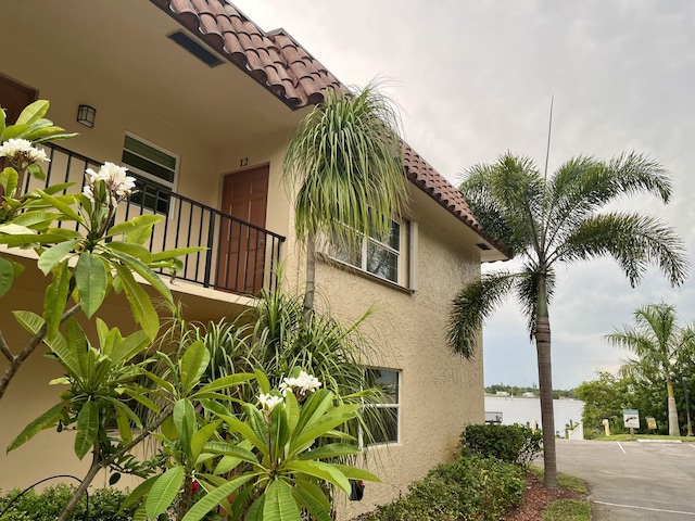 view of property exterior with a balcony