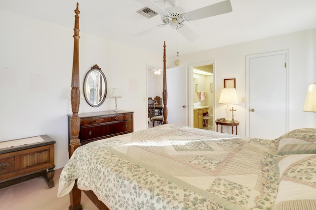 carpeted bedroom with ceiling fan and ensuite bathroom