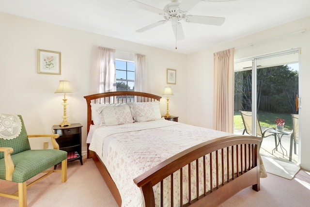 bedroom with ceiling fan, light carpet, and access to outside