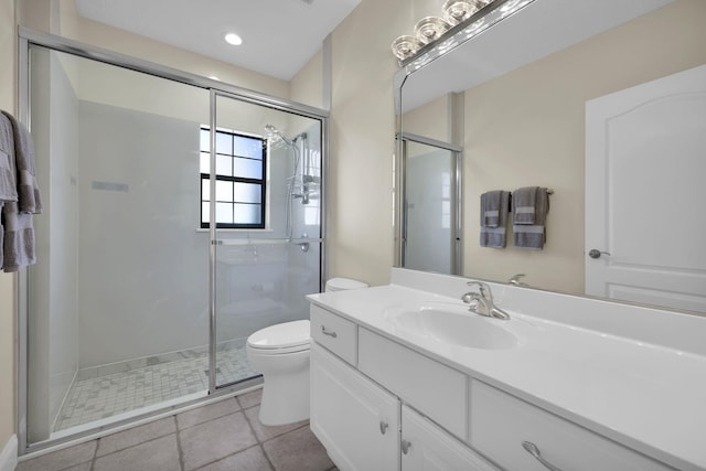 bathroom featuring toilet, recessed lighting, vanity, a shower stall, and tile patterned floors