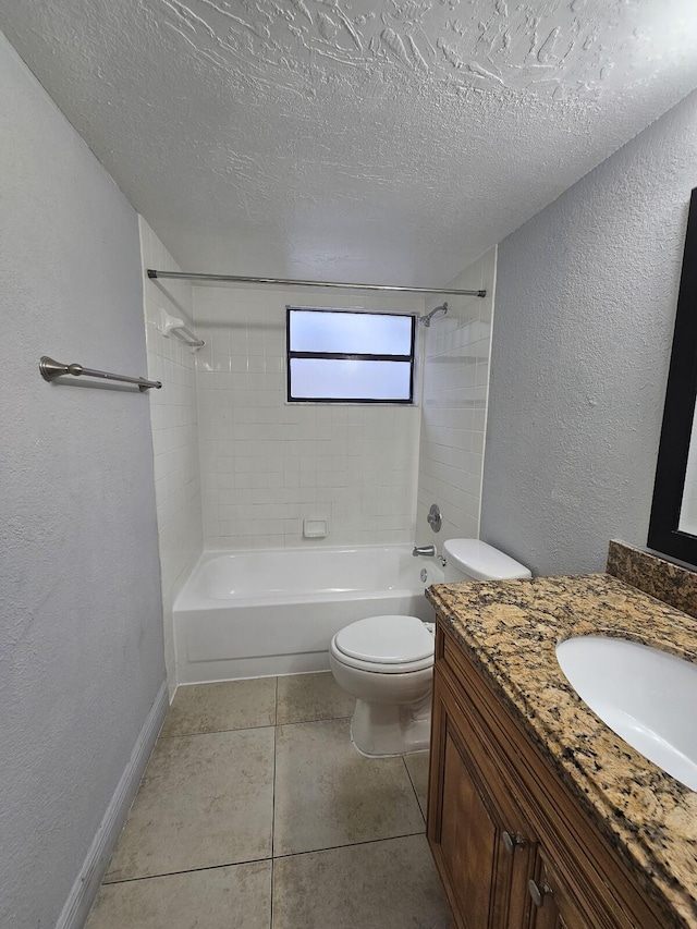 full bathroom featuring vanity, tile patterned flooring, tiled shower / bath combo, toilet, and a textured ceiling