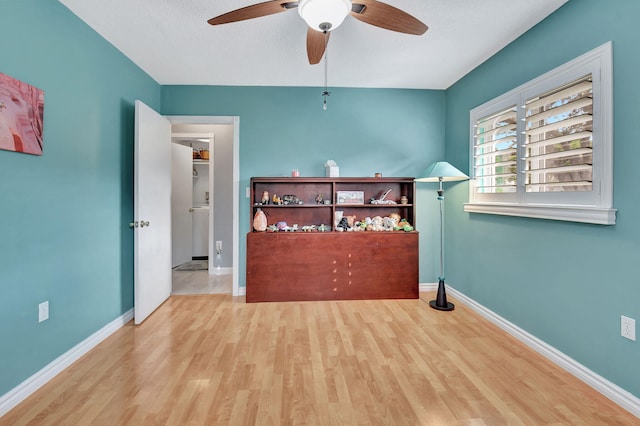 interior space with ceiling fan and light hardwood / wood-style flooring