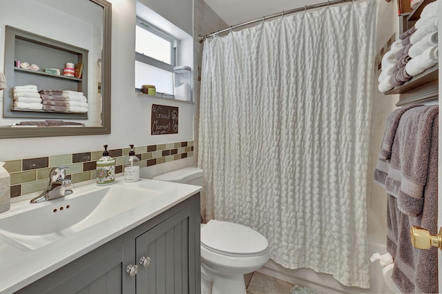 full bathroom featuring toilet, vanity, tile walls, and shower / tub combo with curtain