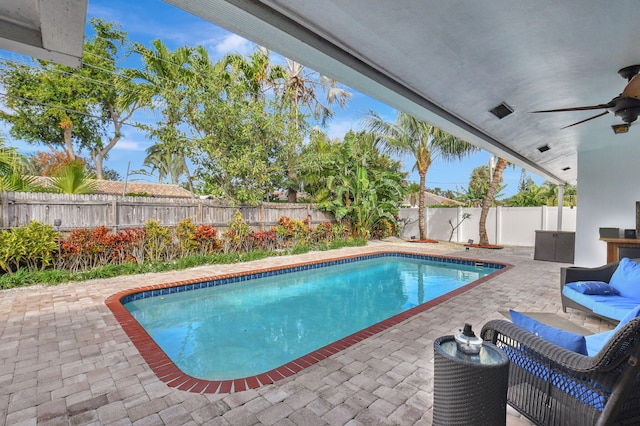 view of pool featuring ceiling fan and a patio